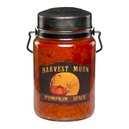 McCall's Candles Harvest Moon Pumpkin Spice 26 oz jar candle with rustic metal lid and decorative handles. Orange wax with cinnamon and nutmeg scent.